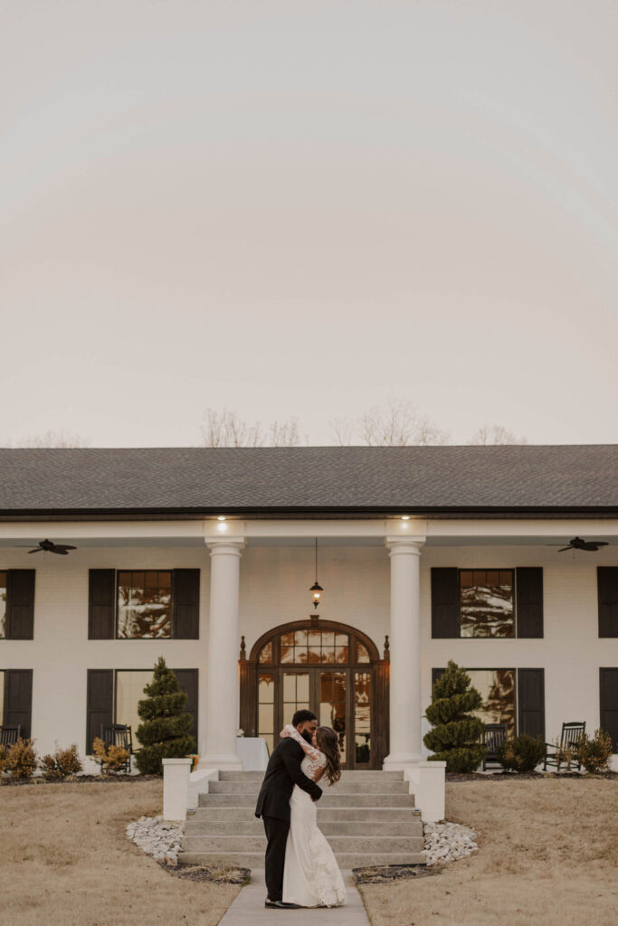 bride and groom kissing at Houstons wedding venue in Northeast Arkansas